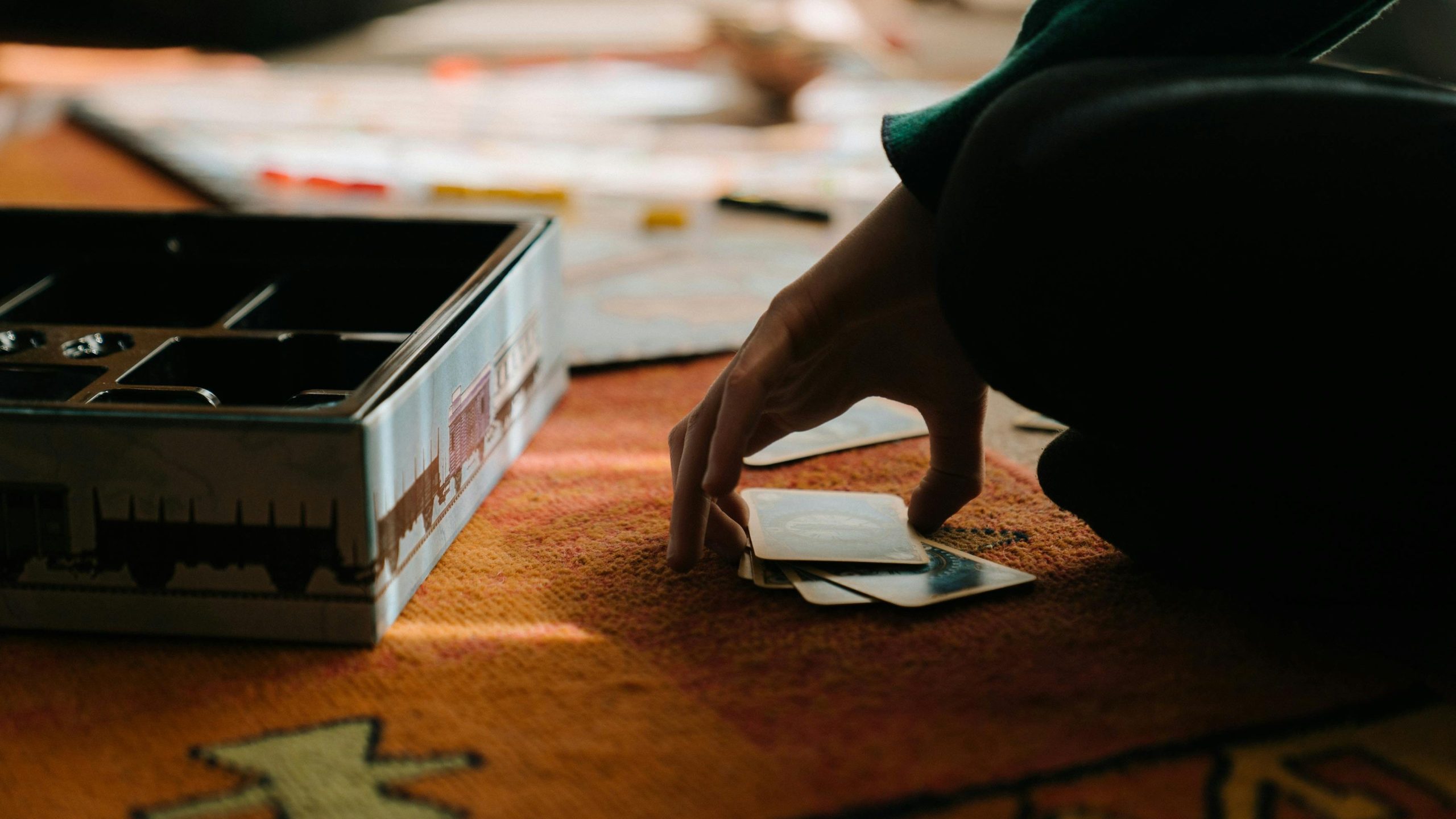 Strategy - Fun Indoor Games - Photo by cottonbro studio: https://www.pexels.com/photo/person-in-green-shirt-playing-cards-4691516/
